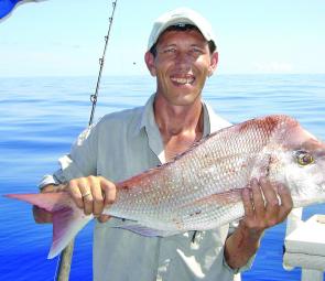 Graham Edmunds with a snapper caught out behind Keppel’s.